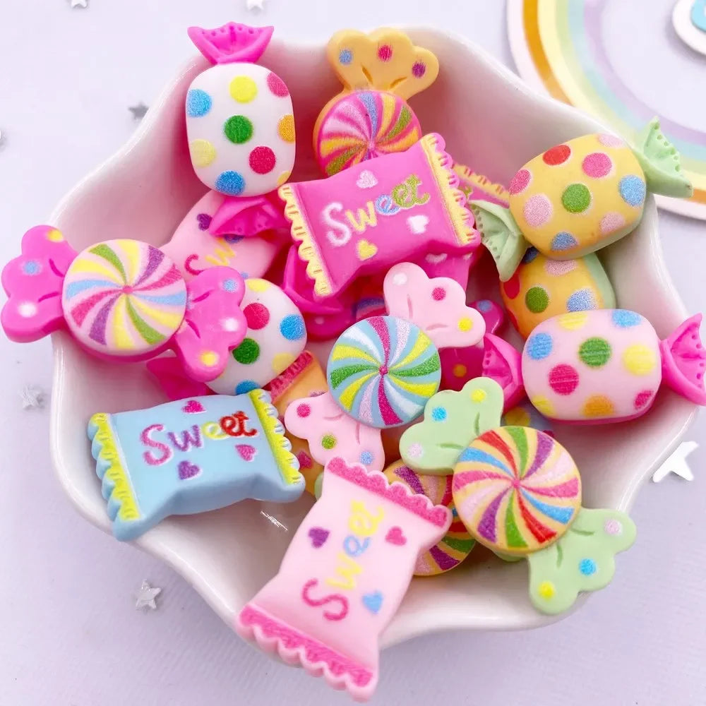 A pink dish filled with colorful candy resin cabochons in various shapes and colors for crafting projects
