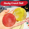 A hand holds a bright yellow and red crunchy ball sensory stress reliever.