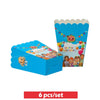 A blue party kit for a birthday celebration featuring balloons and tableware with cartoon characters.