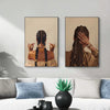 Canvas art featuring a portrait of an African American woman with intricate braided hair and gold jewelry.