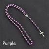 Purple rosary necklace featuring a vintage cross and Virgin Mary pendant.