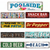 A collection of vintage metal signs featuring various bar and beach themed text like Poolside Paradise Snack Bar and Cold Bee