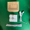 A box of vanity mirror lights with four white light bulbs and an electrical cord.