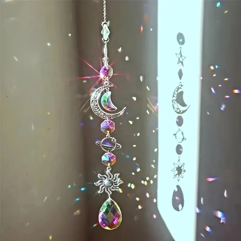 A silver crystal moon and sun wind chime decor set hanging vertically.