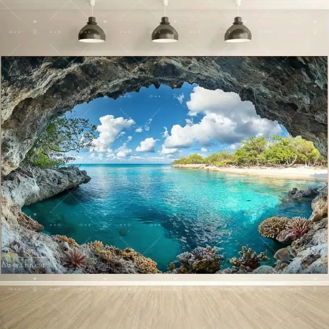 A scenic view of a turquoise ocean cove framed by large rocks and lush greenery under a bright blue sky.