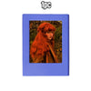 A blue retro magnetic photo frame displaying a portrait of a woman with long, fiery red hair.