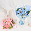 A bouquet of handmade crochet blue and white tulips wrapped in light blue paper and tissue paper.
