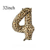 A close-up of a leopard print balloon shaped like a number four.