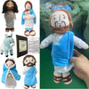 A religious plush doll featuring Jesus and the Virgin Mary figures.