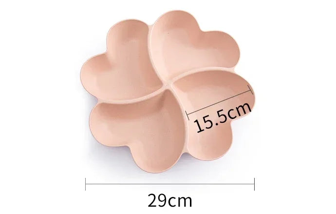 A light pink heart-shaped four-compartment snack tray with dimensions 29cm long and 15.5cm high.