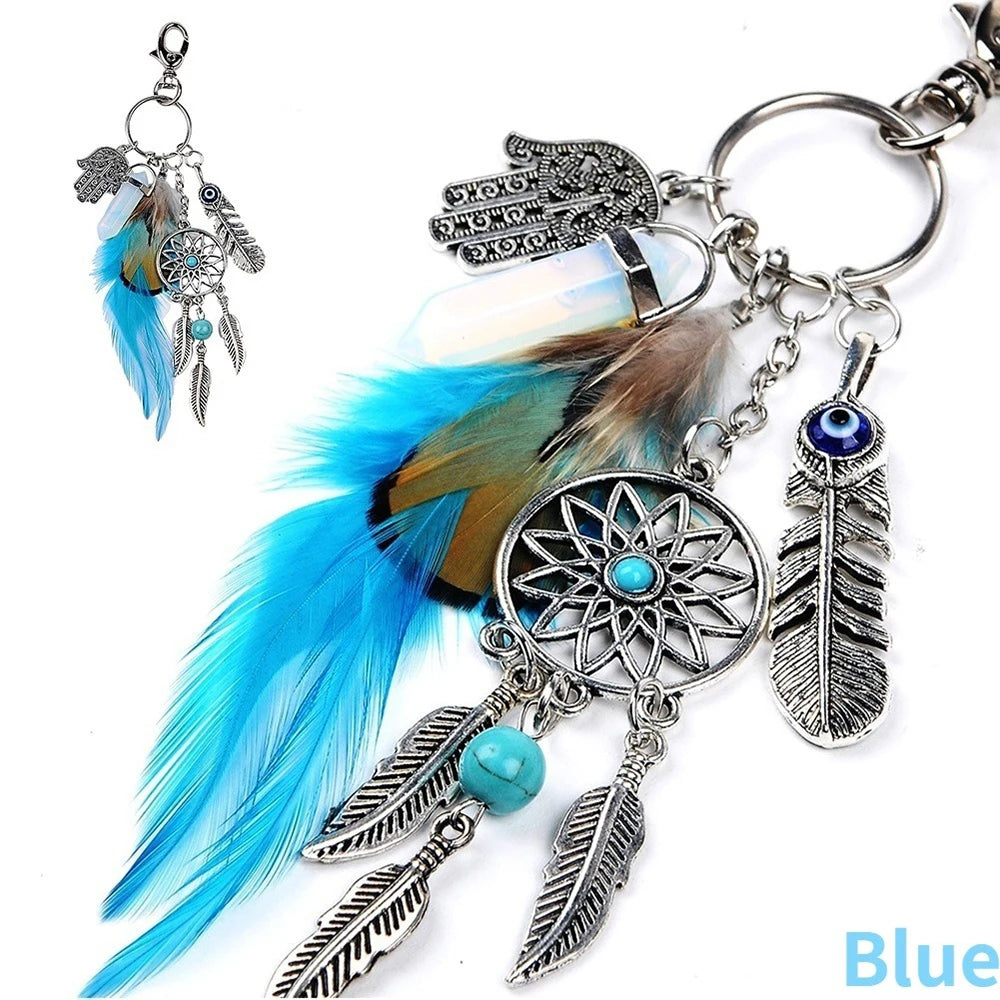 Silver bohemian dream catcher keychain featuring blue and brown feathers and a teal bead tassel