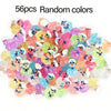 A pile of 56 pieces of glow-in-the-dark resin cruise duck decorations in various random colors.
