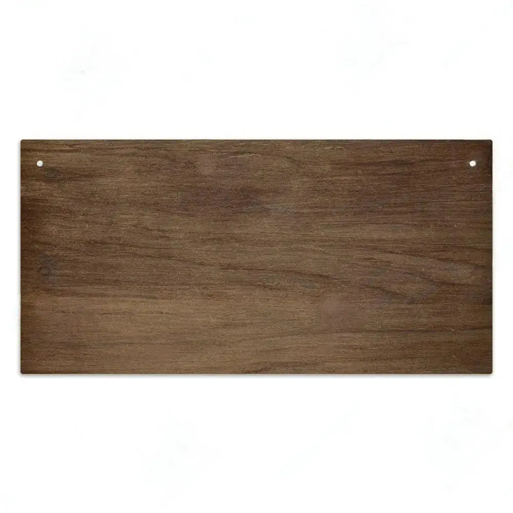 A rectangular piece of dark brown wood used as a custom sign for home decor.