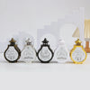 Five decorative lanterns featuring Islamic calligraphy designs in black, white, and gold on a white background.
