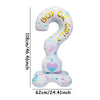 A large, white foil balloon shaped like a question mark with the words BOY or GIRL on it.