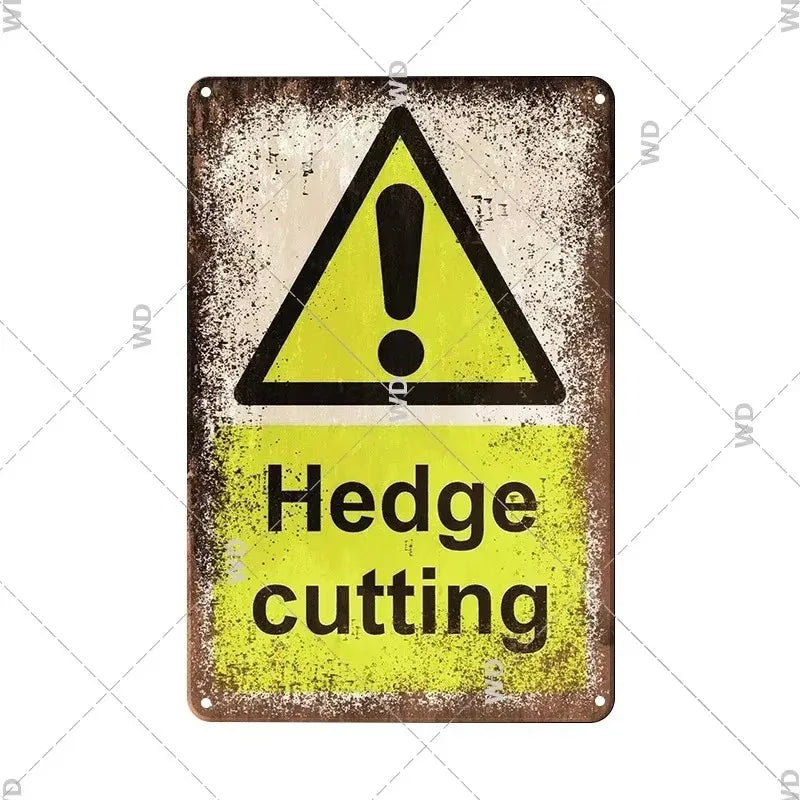 A vintage metal sign with a yellow triangle warning symbol and the text Hedge cutting on it.