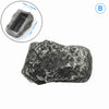 A rough, dark gray garden key hiding stone with a rectangular cavity for keys.