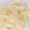 A pile of oversized clear latex balloons in a pale yellow color.