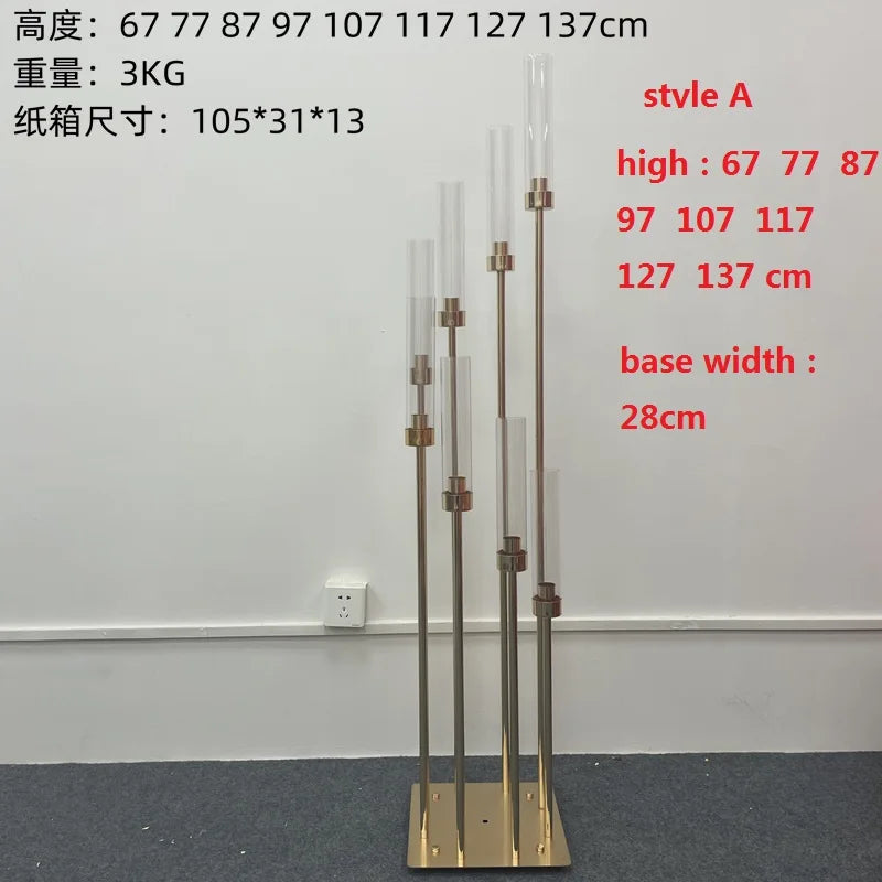 A set of gold metal candelabra stands displaying various heights and a wide base.