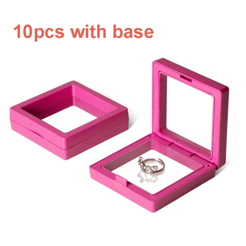 Ten pink floating shadow box jewelry display frames with bases shown on a white background.