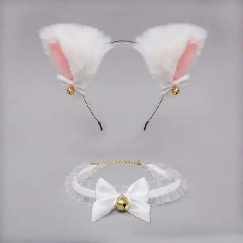 A set of kawaii cat ear headband and a white bow choker with gold accents.