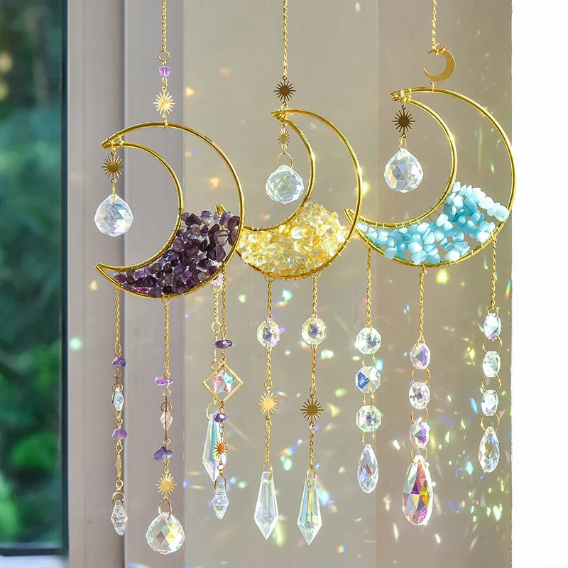 Gold moon suncatcher wind chime with prism accents hanging against a light background.