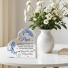 A white acrylic heart plaque with blue floral designs and text thanking a father.