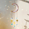 Gold crescent moon dreamcatcher with purple crystals and hanging sun catchers