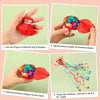 Instructions showing how to rip the bottom paper of a streamer popper and throw the streamer.
