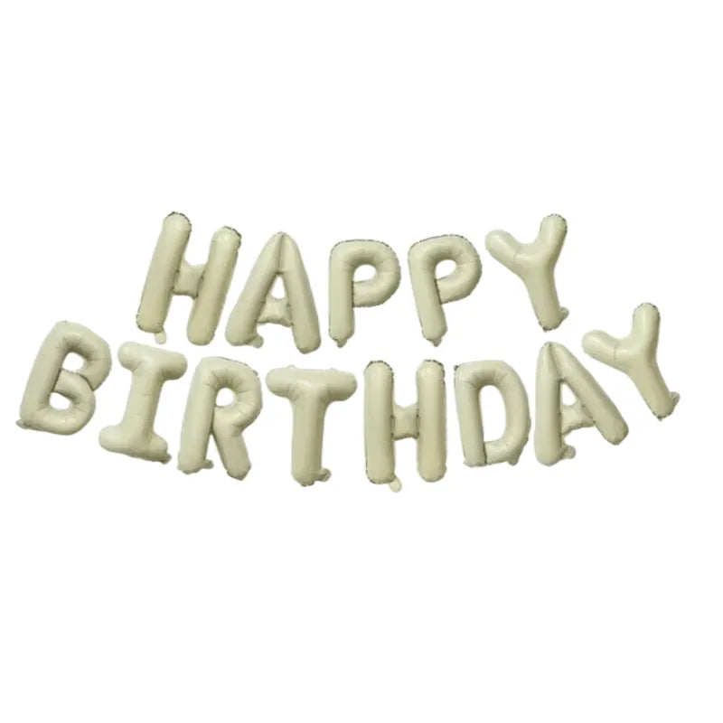 A set of white letter balloons spelling out Happy Birthday for party decoration.