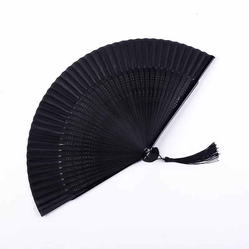 A black traditional Chinese folding fan with fine pleats, shown open and angled.