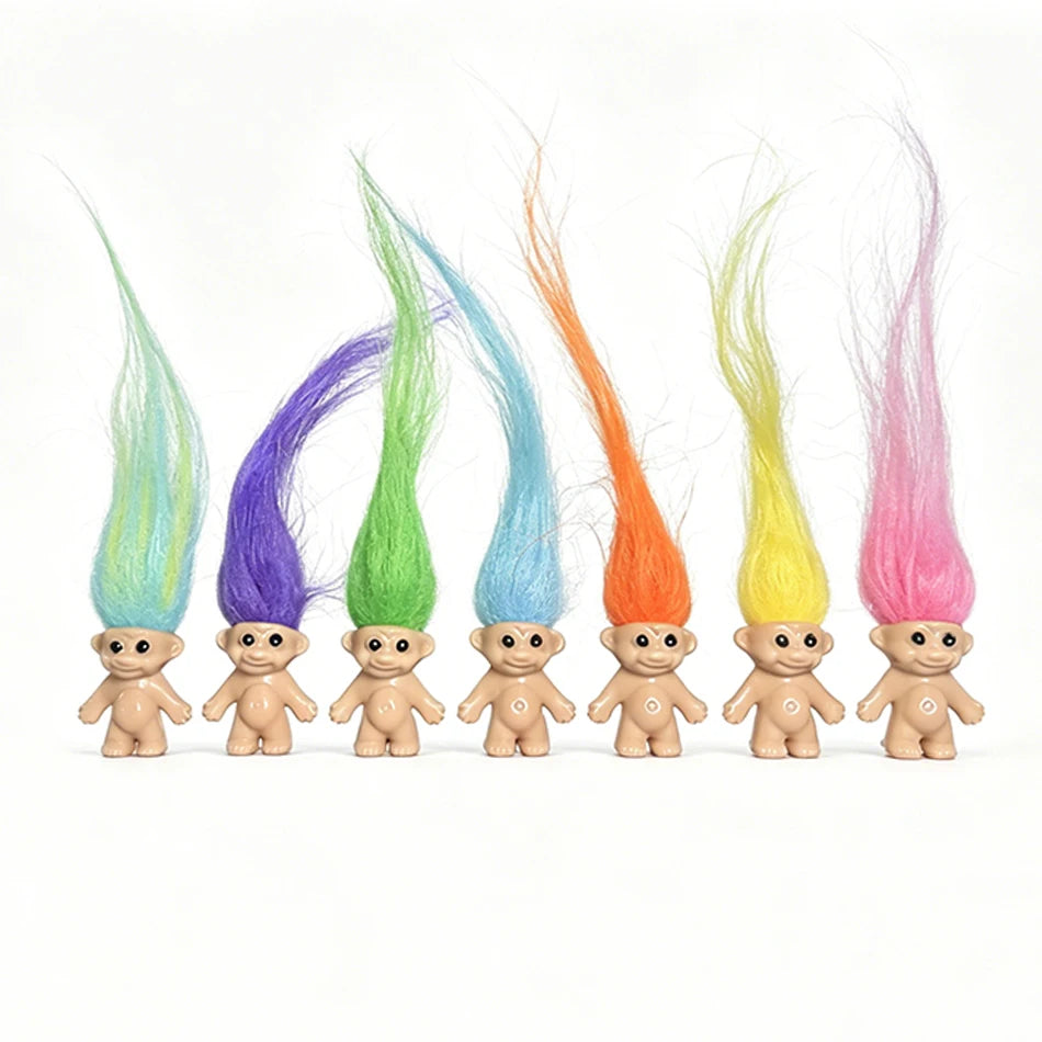 A collection of mini retro troll doll figures with brightly colored, flowing hair.