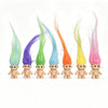 A collection of mini retro troll doll figures with brightly colored, flowing hair.