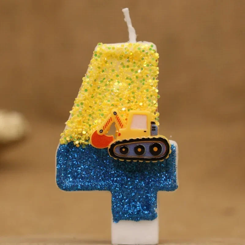 A birthday cake candle shaped like a construction excavator, decorated with yellow glitter and blue glitter.