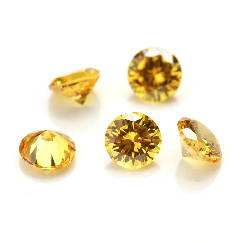 A collection of round and oval yellow gold-toned cubic zirconia loose stones for jewelry making.