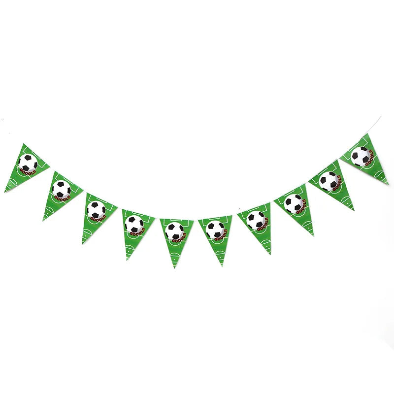 A string of green triangular cake toppers featuring soccer balls for birthday parties