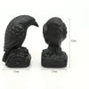 Hand-carved black obsidian raven figurine showing a side view and dimensions.