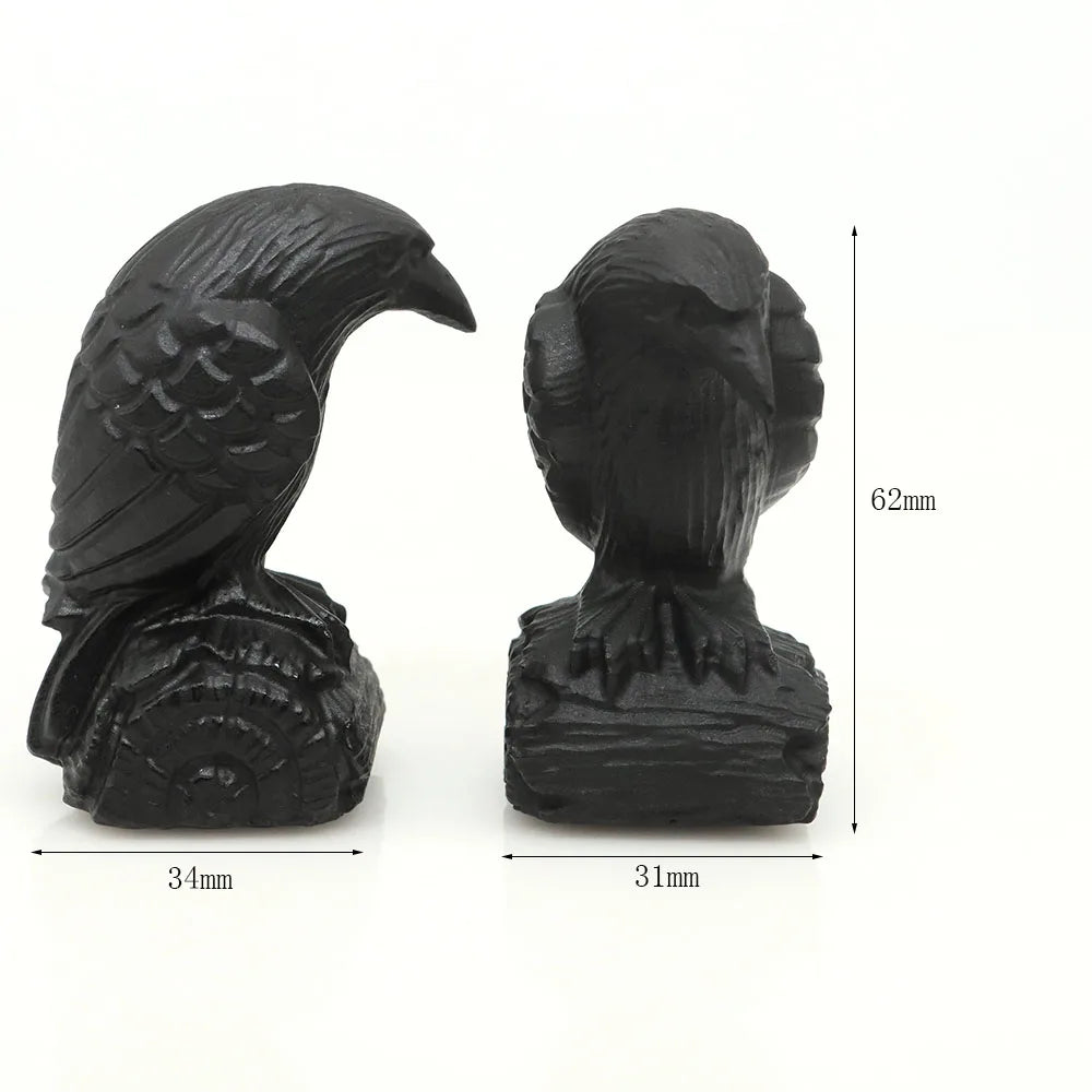 Hand-carved black obsidian raven figurine showing a side view and dimensions.