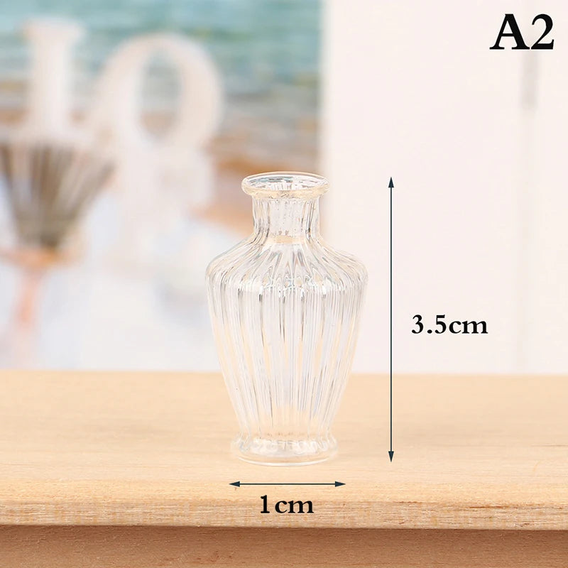 Clear glass miniature vase and wine bottle set on a wooden surface