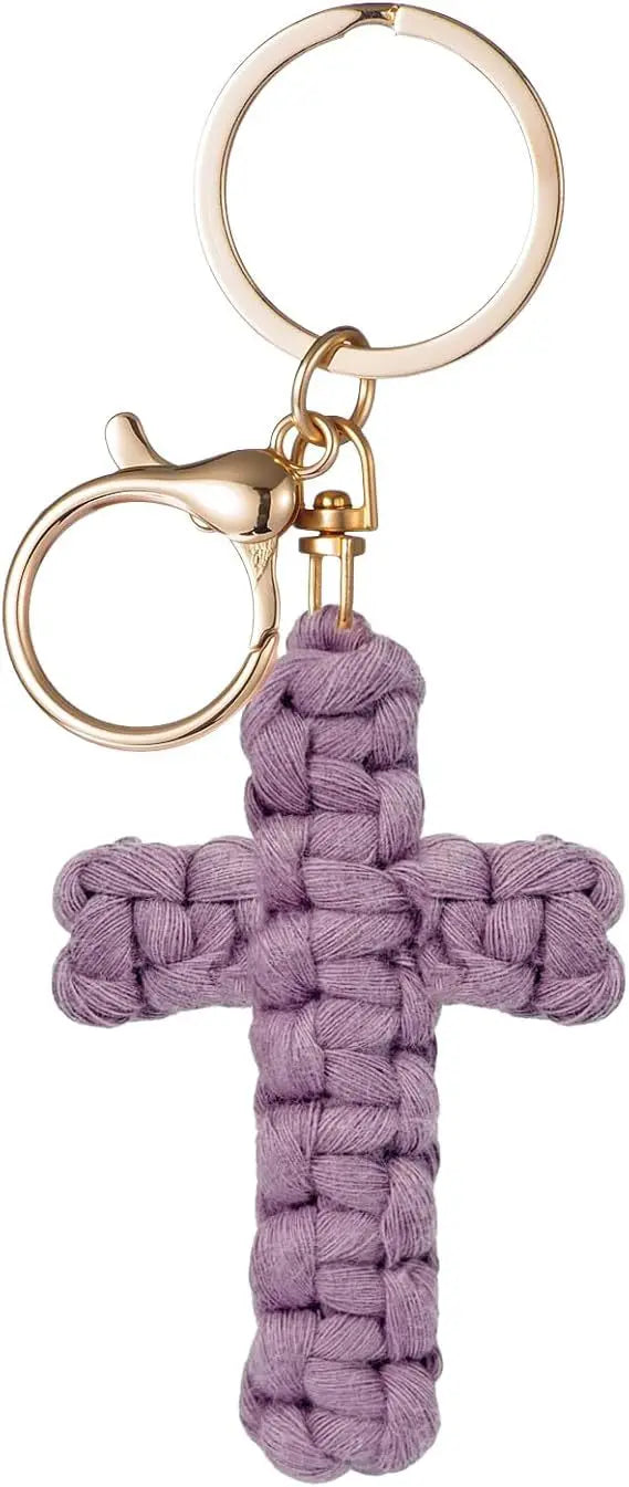 A purple woven cross keychain with a gold-toned metal clasp and ring.