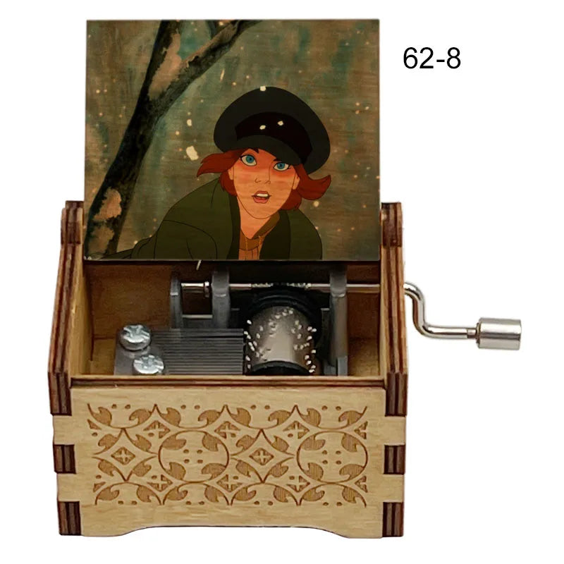 A hand-cranked wooden music box featuring a painted character and an internal mechanism.