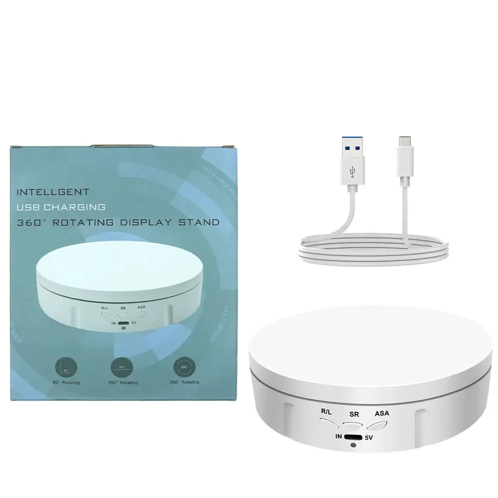 A white 360° rotating display stand for jewelry and items with USB charging cables.