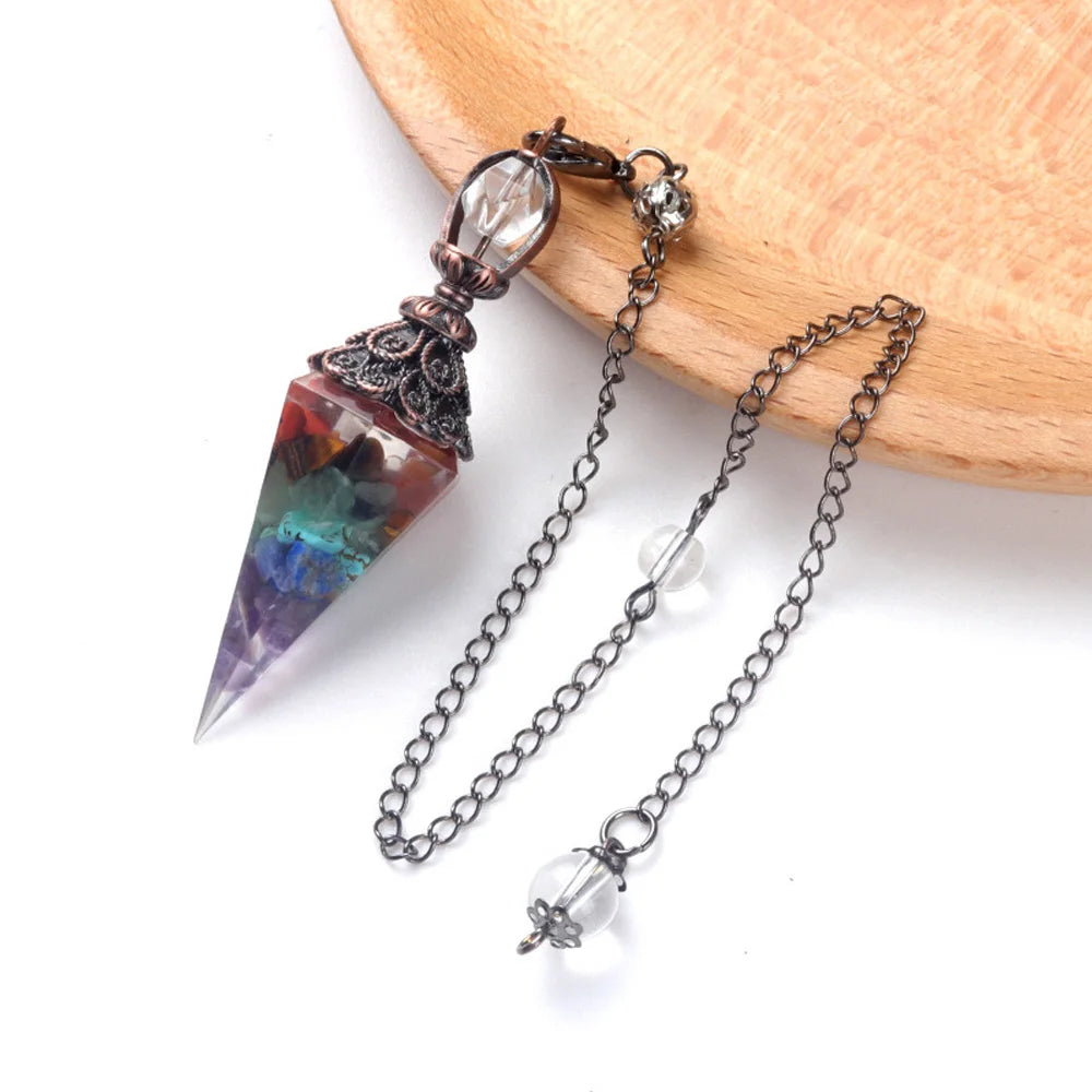 A natural crystal pendulum necklace set featuring a purple and green point crystal pendant on a silver chain.