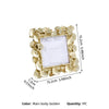 Golden resin picture frame with a leaf design and gold border