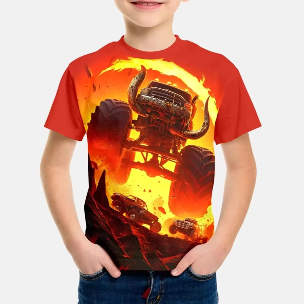 A boy wearing a red t-shirt with a full graphic print of the Monster Jam Grave Digger vehicle engulfed in flames.