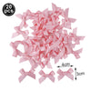 A pile of pink ribbon bows for birthday party decorations