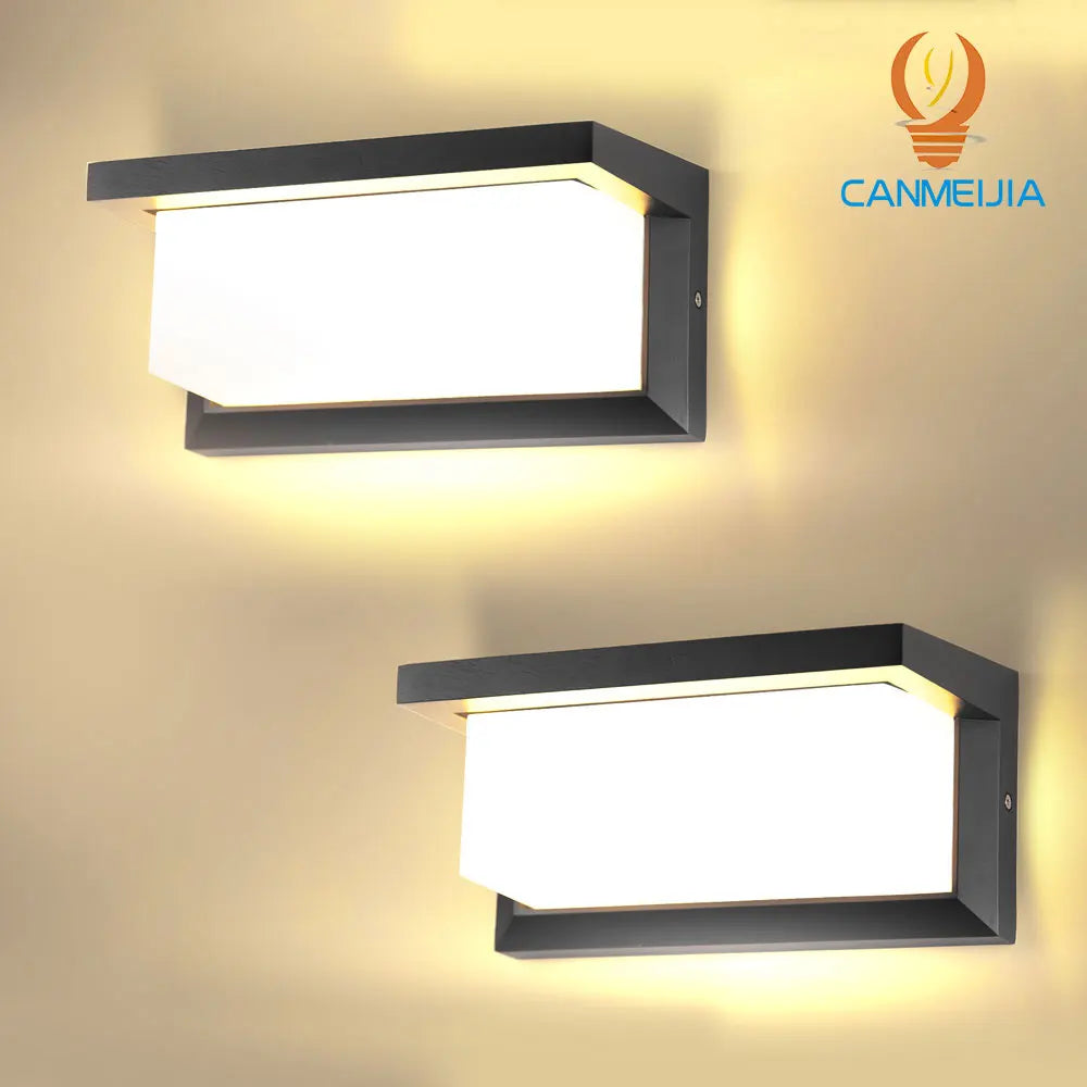 A modern rectangular LED wall sconce with a black frame and bright white light mounted on a beige wall.