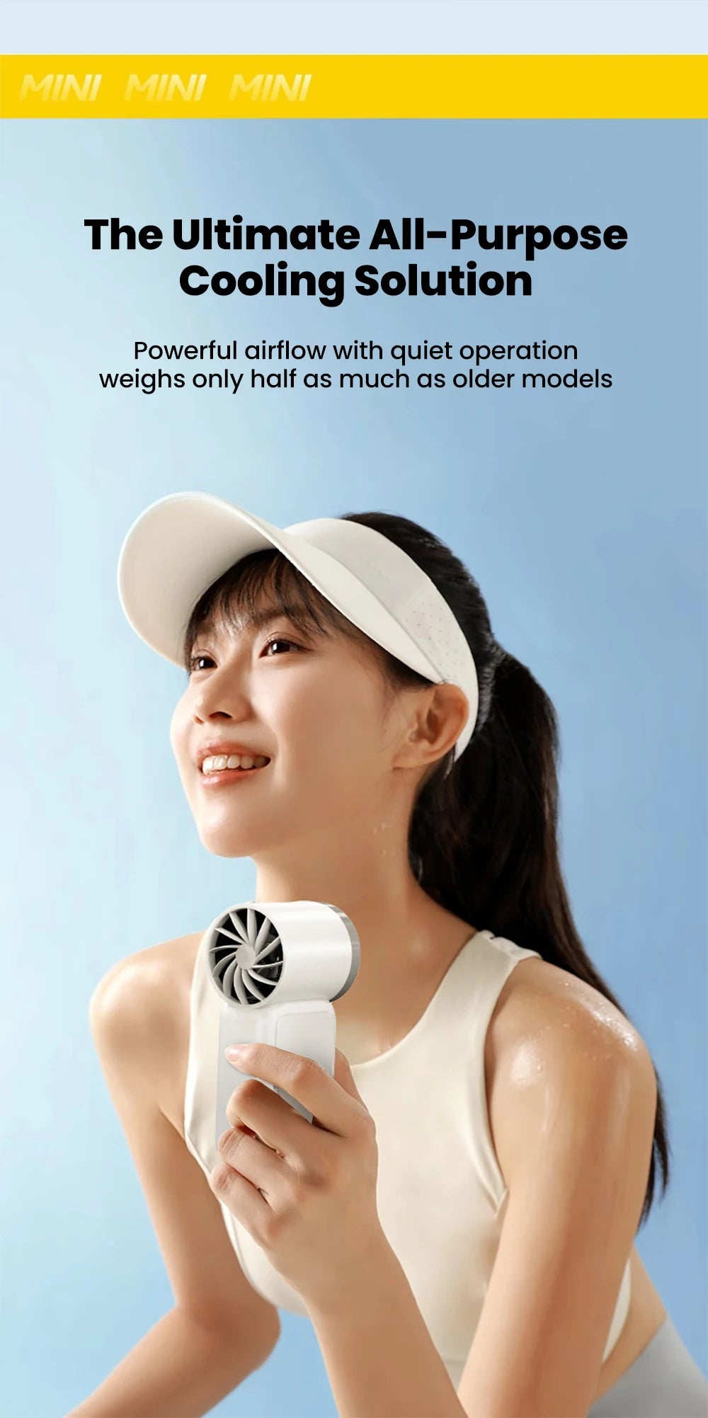 A young woman is using a white portable rechargeable mini handheld fan for cooling.