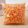 A pile of peach colored PE foam artificial rose flowers for DIY decor.