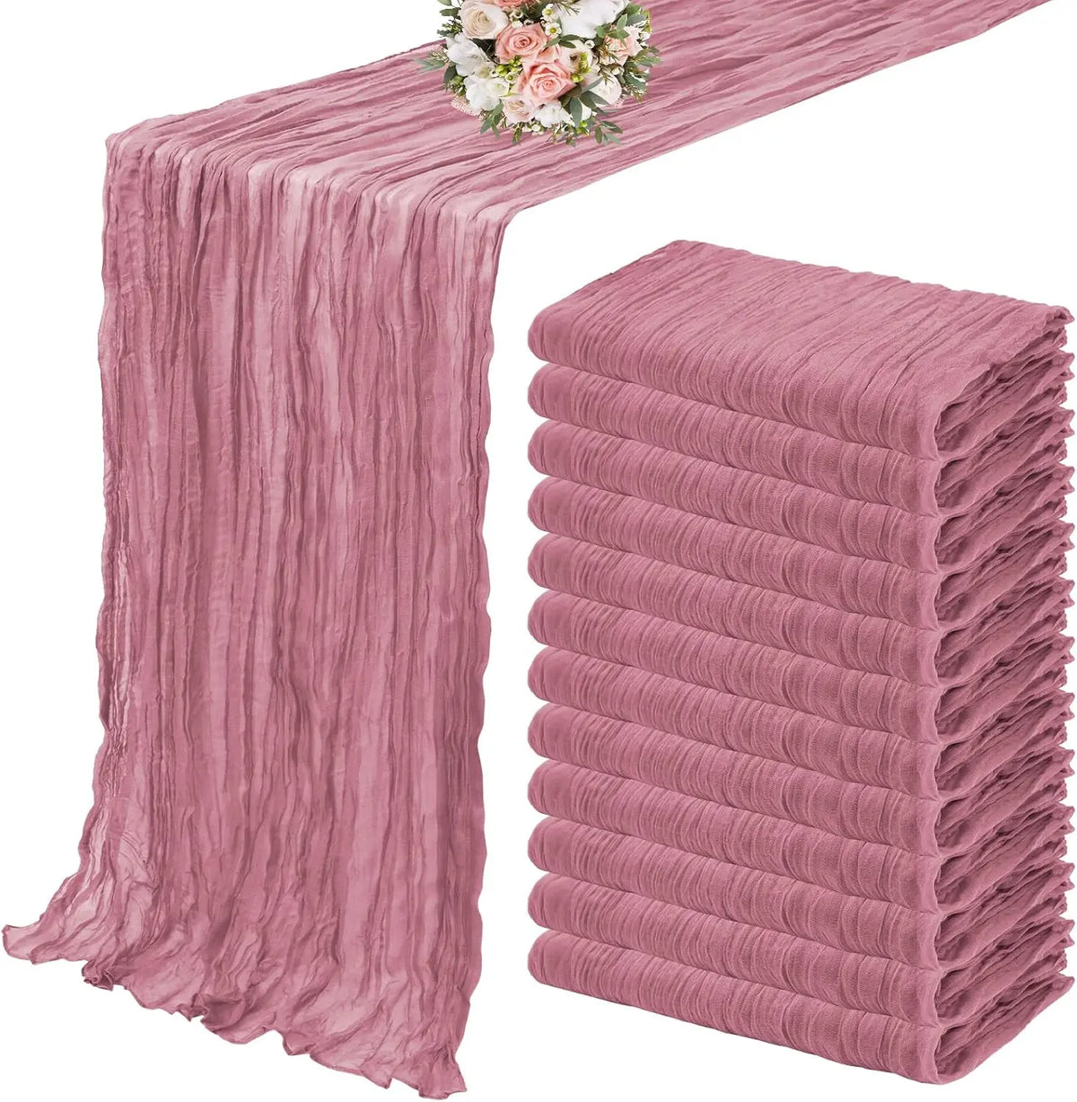 A set of ten terracotta semi-sheer cheesecloth table runners in a dusty rose color displayed on a table.